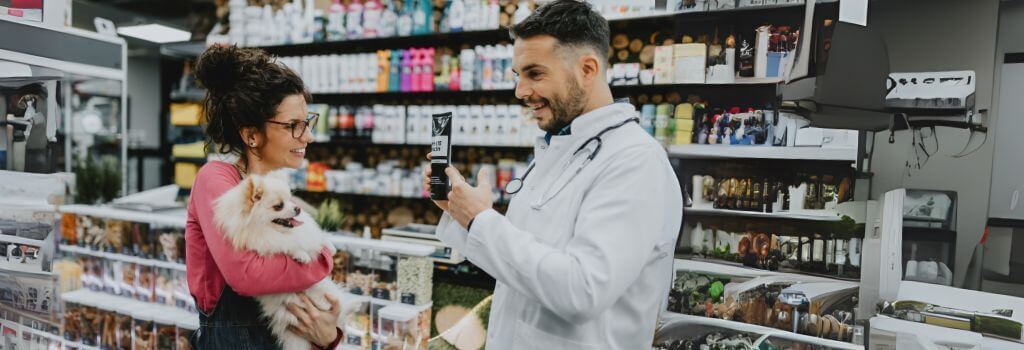 A pet owner shopping at a veterinary pharmacy