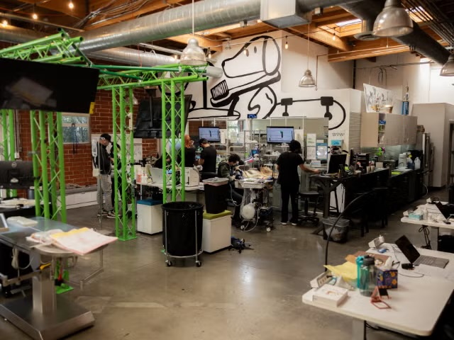 Wide view of a modern veterinary clinic interior with staff at workstations, representing ophthalmology services in Sherman Oaks