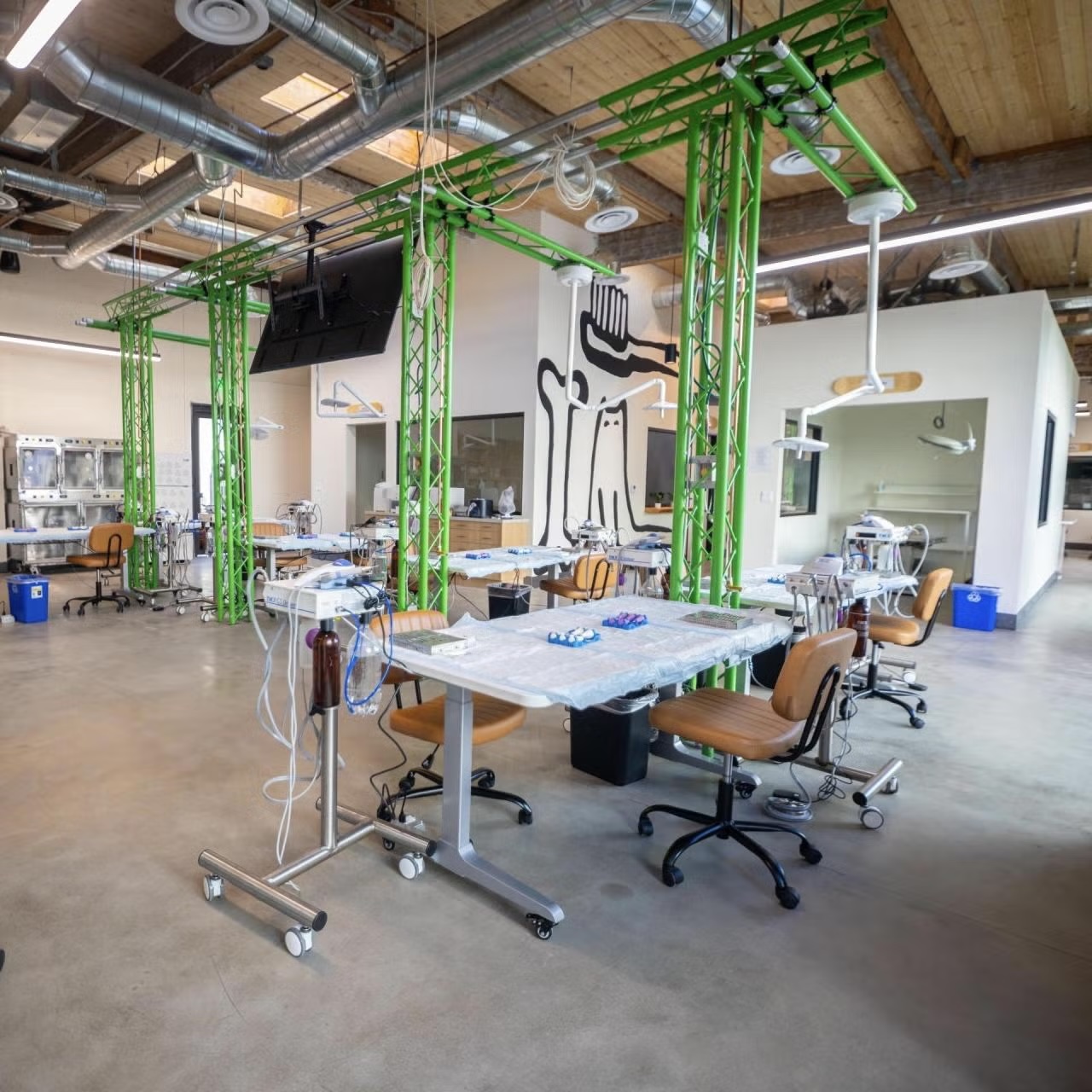 Spacious veterinary education center training lab with multiple dental stations and equipment, representing career opportunities in Sherman Oaks